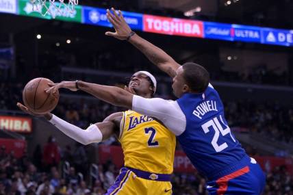 Jan 23, 2024; Los Angeles, California, USA; Los Angeles Clippers guard Norman Powell (24) blocks a shot by Los Angeles Lakers forward Jarred Vanderbilt (2) in the second half at Crypto.com Arena. Mandatory Credit: Jayne Kamin-Oncea-USA TODAY Sports