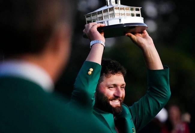 Apr 9, 2023; Augusta, Georgia, USA; Masters champion Jon Rahm holds up the trophy after the final round of The Masters golf tournament.