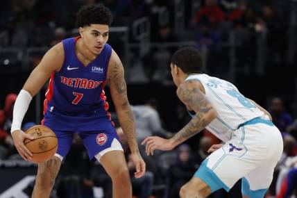 Jan 24, 2024; Detroit, Michigan, USA;  Detroit Pistons guard Killian Hayes (7) dribbles defended by Charlotte Hornets guard Nick Smith Jr. (8) in the first half at Little Caesars Arena. Mandatory Credit: Rick Osentoski-USA TODAY Sports
