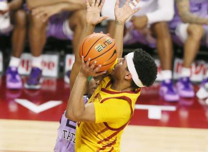 Iowa State Cyclones guard Tamin Lipsey (3) takes a shot around Kansas State Wildcats guard Tylor Perry (2) during the first half in the Big-12 conference showdown of an NCAA college basketball at Hilton Coliseum on Wednesday, Jan. 24, 2024, in Ames, Iowa.