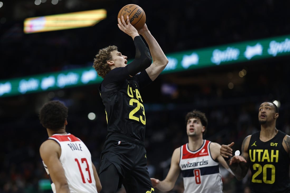 Jan 25, 2024; Washington, District of Columbia, USA; Utah Jazz forward Lauri Markkanen (23) shoots the ball as Washington Wizards forward Deni Avdija (8) looks on in the second half at Capital One Arena. Mandatory Credit: Geoff Burke-USA TODAY Sports