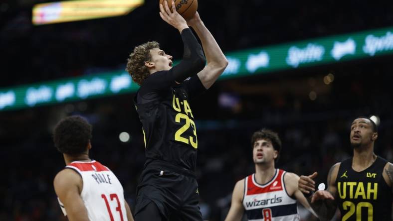 Jan 25, 2024; Washington, District of Columbia, USA; Utah Jazz forward Lauri Markkanen (23) shoots the ball as Washington Wizards forward Deni Avdija (8) looks on in the second half at Capital One Arena. Mandatory Credit: Geoff Burke-USA TODAY Sports