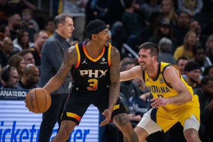 Jan 26, 2024; Indianapolis, Indiana, USA; Phoenix Suns guard Bradley Beal (3) dribbles the ball while Indiana Pacers guard T.J. McConnell (9) defends in the first half at Gainbridge Fieldhouse. Mandatory Credit: Trevor Ruszkowski-USA TODAY Sports