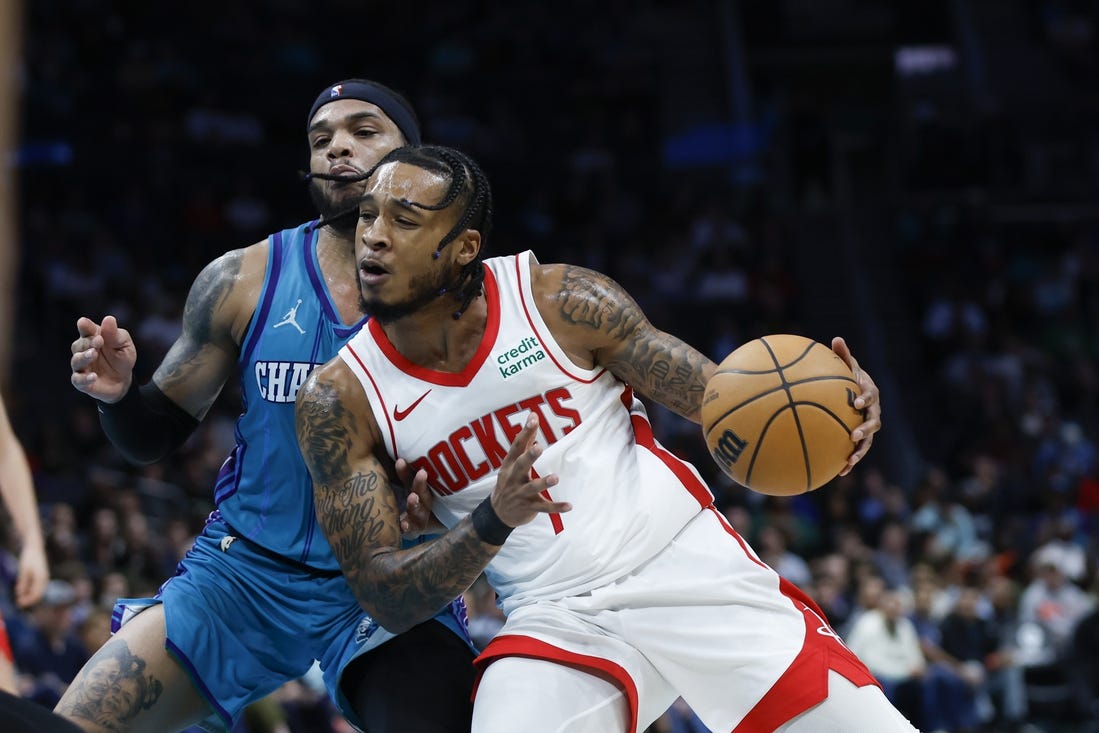 Jan 26, 2024; Charlotte, North Carolina, USA; Houston Rockets forward Cam Whitmore (7) moves against Charlotte Hornets forward Miles Bridges (0) during the second half at Spectrum Center. Mandatory Credit: Nell Redmond-USA TODAY Sports