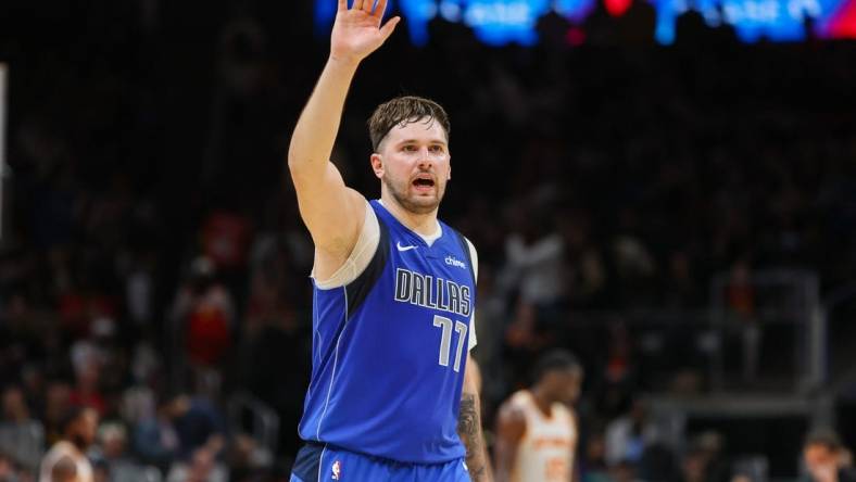 Jan 26, 2024; Atlanta, Georgia, USA; Dallas Mavericks guard Luka Doncic (77) waves to the crowd against the Atlanta Hawks in the fourth quarter at State Farm Arena. Mandatory Credit: Brett Davis-USA TODAY Sports