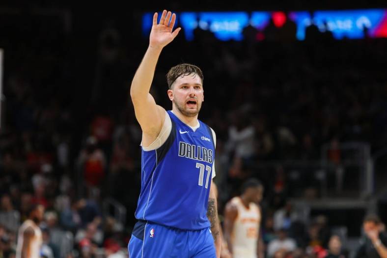 Jan 26, 2024; Atlanta, Georgia, USA; Dallas Mavericks guard Luka Doncic (77) waves to the crowd against the Atlanta Hawks in the fourth quarter at State Farm Arena. Mandatory Credit: Brett Davis-USA TODAY Sports