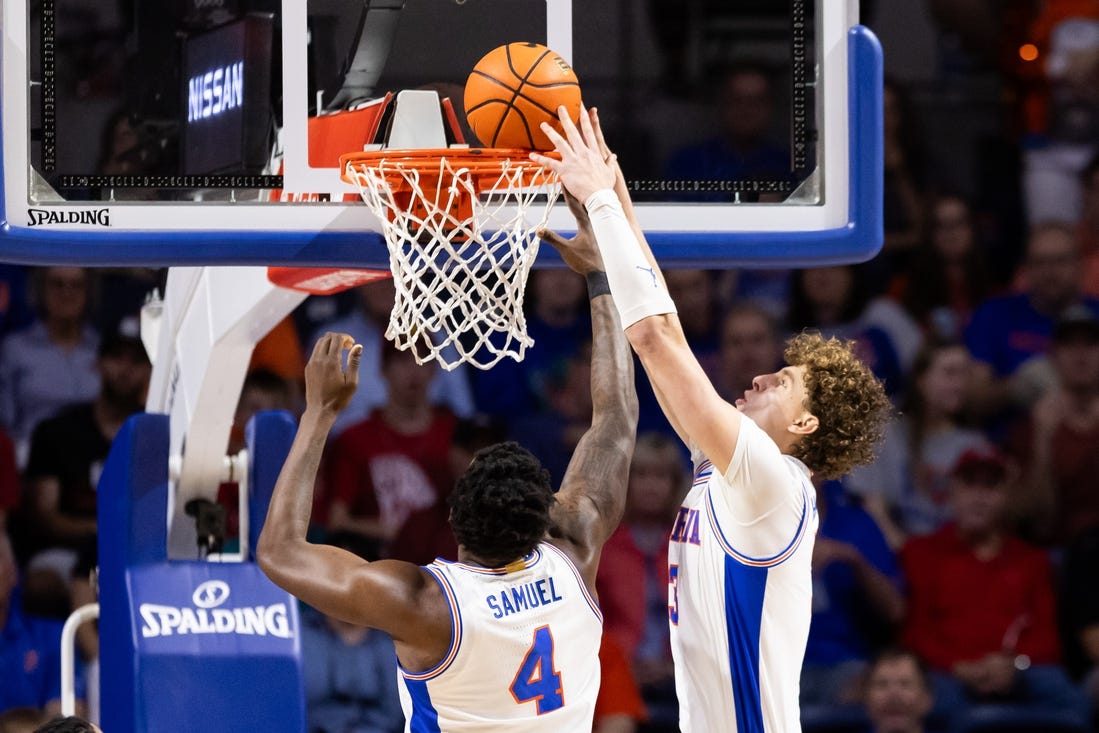 Jan 27, 2024; Gainesville, Florida, USA; Florida Gators center Micah Handlogten (3) dunks the ball against the Georgia Bulldogs during the first half at Exactech Arena at the Stephen C. O'Connell Center. Mandatory Credit: Matt Pendleton-USA TODAY Sports