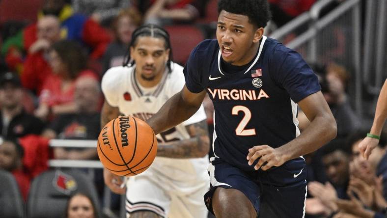 Jan 27, 2024; Louisville, Kentucky, USA;  Virginia Cavaliers guard Reece Beekman (2) dribbles against the Louisville Cardinals during the first half at KFC Yum! Center. Mandatory Credit: Jamie Rhodes-USA TODAY Sports