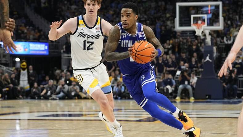 Jan 27, 2024; Milwaukee, Wisconsin, USA;  Seton Hall Pirates guard Al-Amir Dawes (2) drives for the basket in front of Marquette Golden Eagles forward Ben Gold (12) during the first half at Fiserv Forum. Mandatory Credit: Jeff Hanisch-USA TODAY Sports