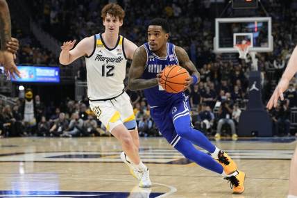 Jan 27, 2024; Milwaukee, Wisconsin, USA;  Seton Hall Pirates guard Al-Amir Dawes (2) drives for the basket in front of Marquette Golden Eagles forward Ben Gold (12) during the first half at Fiserv Forum. Mandatory Credit: Jeff Hanisch-USA TODAY Sports