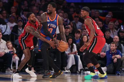 Jan 27, 2024; New York, New York, USA; New York Knicks forward Julius Randle (30) looks to pass as Miami Heat forward Haywood Highsmith (24) and forward Jimmy Butler (22) defend during the first half at Madison Square Garden. Mandatory Credit: Vincent Carchietta-USA TODAY Sports