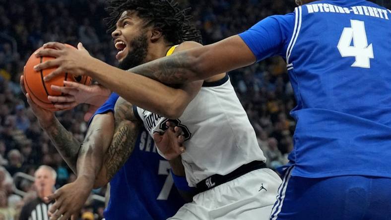 Marquette forward David Joplin (23) drives between Seton Hall forward Sadraque NgaNga (7) and center Elijah Hutchins-Everett (4) during the first half of their game Saturday, January 27, 2024 at Fiserv Forum in Milwaukee, Wisconsin.Mark Hoffman/Milwaukee Journal Sentinel