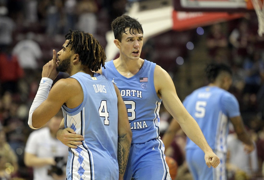 Jan 27, 2024; Tallahassee, Florida, USA; North Carolina Tarheels guard RJ Davis (4) and guard Cormac Ryan (3) celebrate after winning the game against the Florida State Seminoles at Donald L. Tucker Center. Mandatory Credit: Melina Myers-USA TODAY Sports