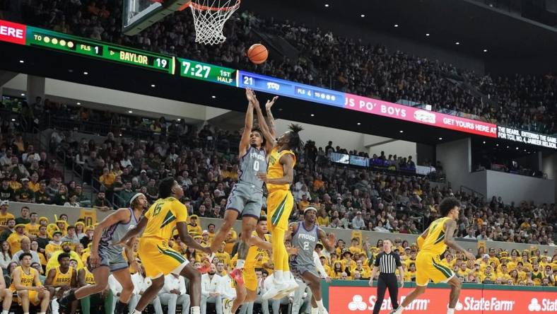 Jan 27, 2024; Waco, Texas, USA; TCU Horned Frogs guard Micah Peavy (0) shoots over Baylor Bears guard Ja'Kobe Walter (4) during the first half at Paul and Alejandra Foster Pavilion. Mandatory Credit: Raymond Carlin III-USA TODAY Sports