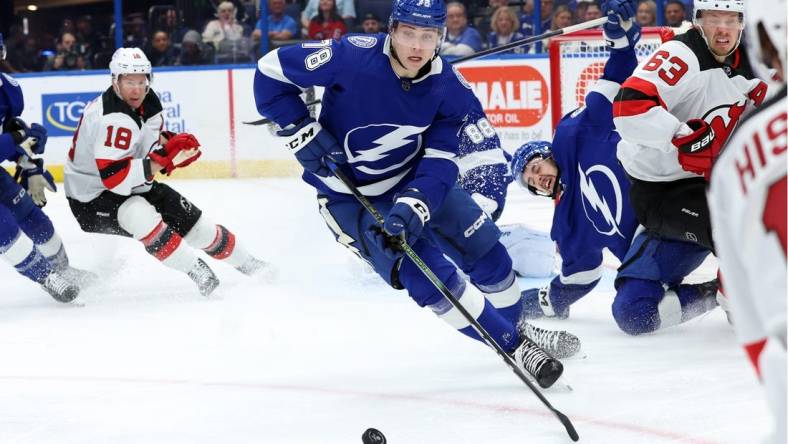 Jan 27, 2024; Tampa, Florida, USA; Tampa Bay Lightning defenseman Emil Martinsen Lilleberg (78) skates with the puck against the New Jersey Devils during the second period at Amalie Arena. Mandatory Credit: Kim Klement Neitzel-USA TODAY Sports