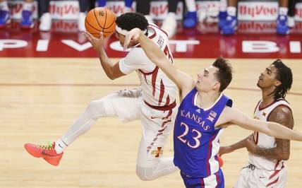 Iowa State Cyclones guard Tamin Lipsey (3) drives to the basket as Kansas Jayhawks forward Parker Braun (23) attempts to defend and founded during the first half in the Big-12 conference showdown of an NCAA college basketball at Hilton Coliseum on Saturday, Jan. 27, 2024, in Ames, Iowa.