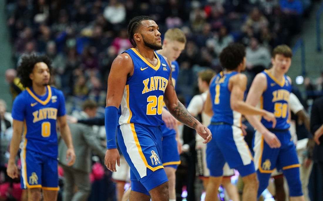 Jan 28, 2024; Hartford, Connecticut, USA; Xavier Musketeers guard Dayvion McKnight (20) and teammates head to the sideline as they take on the UConn Huskies in the first half at XL Center. Mandatory Credit: David Butler II-USA TODAY Sports