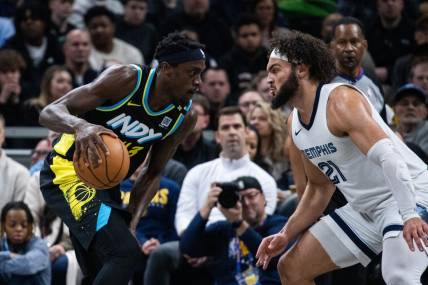 Jan 28, 2024; Indianapolis, Indiana, USA; Indiana Pacers forward Pascal Siakam (43) dribbles the ball while Memphis Grizzlies forward David Roddy (21) defends in the first half at Gainbridge Fieldhouse. Mandatory Credit: Trevor Ruszkowski-USA TODAY Sports