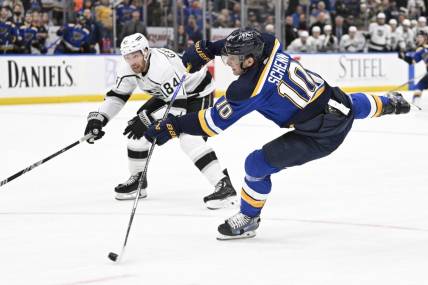 Jan 28, 2024; St. Louis, Missouri, USA; St. Louis Blues center Brayden Schenn (10) takes a shot against the Los Angeles Kings during overtime at Enterprise Center. Mandatory Credit: Jeff Le-USA TODAY Sports