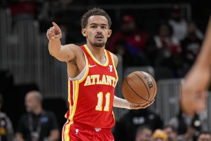 Jan 28, 2024; Atlanta, Georgia, USA; Atlanta Hawks guard Trae Young (11) points to a teammate against the Toronto Raptors during the first half at State Farm Arena. Mandatory Credit: Dale Zanine-USA TODAY Sports