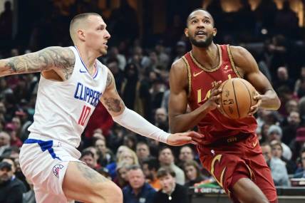 Jan 29, 2024; Cleveland, Ohio, USA; Cleveland Cavaliers forward Evan Mobley (4) drives to the basket against Los Angeles Clippers center Daniel Theis (10) during the first half at Rocket Mortgage FieldHouse. Mandatory Credit: Ken Blaze-USA TODAY Sports