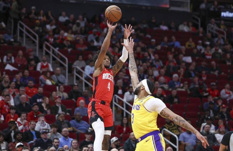 Jan 29, 2024; Houston, Texas, USA; Houston Rockets guard Jalen Green (4) shoots the ball as Los Angeles Lakers forward Anthony Davis (3) defends during the first quarter at Toyota Center. Mandatory Credit: Troy Taormina-USA TODAY Sports