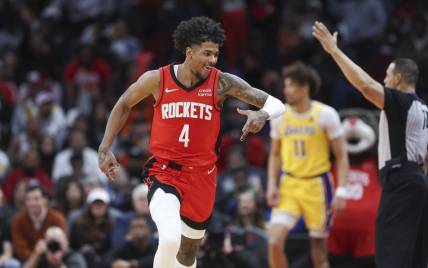 Jan 29, 2024; Houston, Texas, USA; Houston Rockets guard Jalen Green (4) celebrates after scoring a basket during the third quarter against the Los Angeles Lakers at Toyota Center. Mandatory Credit: Troy Taormina-USA TODAY Sports