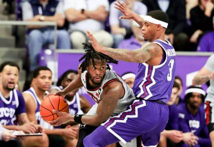 Jan 30, 2024; Fort Worth, Texas, USA;  Texas Tech Red Raiders guard Joe Toussaint (6) looks to pass as TCU Horned Frogs guard Avery Anderson III (3) defends during the first half at Ed and Rae Schollmaier Arena. Mandatory Credit: Kevin Jairaj-USA TODAY Sports