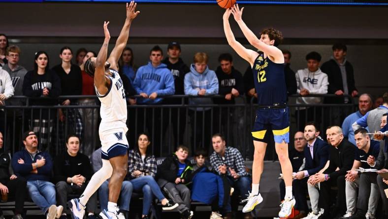 Jan 30, 2024; Villanova, Pennsylvania, USA; Marquette Golden Eagles forward Ben Gold (12) shoots against Villanova Wildcats forward Eric Dixon (43) in the first half at William B. Finneran Pavilion. Mandatory Credit: Kyle Ross-USA TODAY Sports