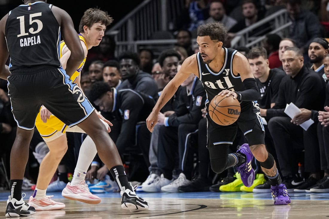 Jan 30, 2024; Atlanta, Georgia, USA; Atlanta Hawks guard Trae Young (11) dribbles against the Los Angeles Lakers during the first half at State Farm Arena. Mandatory Credit: Dale Zanine-USA TODAY Sports