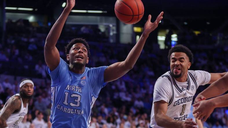 Jan 30, 2024; Atlanta, Georgia, USA; North Carolina Tar Heels forward Jalen Washington (13) and Georgia Tech Yellow Jackets guard Kyle Sturdivant (1) reach for a rebound in the first half at McCamish Pavilion. Mandatory Credit: Brett Davis-USA TODAY Sports