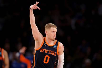 Jan 30, 2024; New York, New York, USA; New York Knicks guard Donte DiVincenzo (0) celebrates his three point shot against the Utah Jazz during the third quarter at Madison Square Garden. Mandatory Credit: Brad Penner-USA TODAY Sports