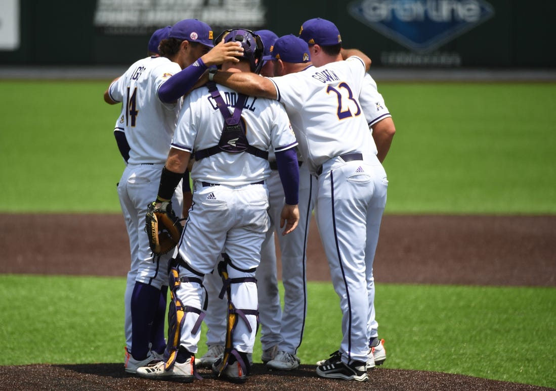 Jun 12, 2021; Nashville, TN, USA; East Carolina Pirates head coach Cliff Godwin (23) talks with his team on the mound during the ninth inning against the Vanderbilt Commodores in the Nashville Super Regional of the NCAA Baseball Tournament at Hawkins Field. Mandatory Credit: Christopher Hanewinckel-USA TODAY Sports