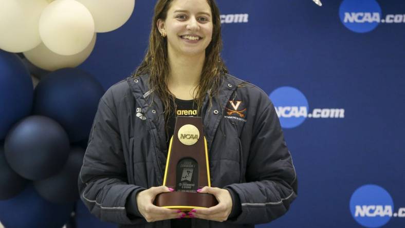 Mar 18, 2022; Atlanta, Georgia, USA; Virginia Cavaliers swimmer Kate Douglass holds a trophy after winning the 400 IM at the NCAA Swimming & Diving Championships at Georgia Tech. Mandatory Credit: Brett Davis-USA TODAY Sports