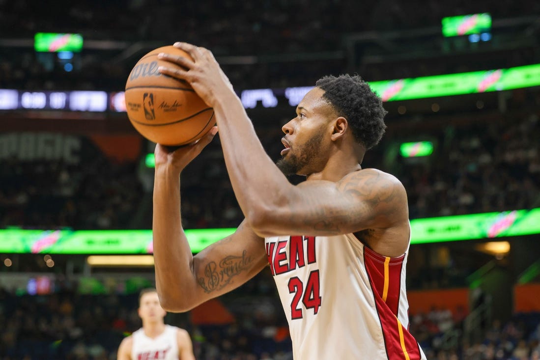 Apr 10, 2022; Orlando, Florida, USA; Miami Heat forward Haywood Highsmith (24) shoots a three-point basket against the Orlando Magic during the first quarter at Amway Center. Mandatory Credit: Mike Watters-USA TODAY Sports