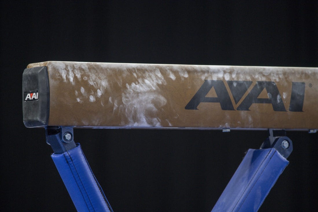 Apr 16, 2022; Fort Worth, TX, USA; A view of balance beam and powder marks during the warmups before the finals of the 2022 NCAA women's gymnastics championship at Dickies Arena. Mandatory Credit: Jerome Miron-USA TODAY Sports