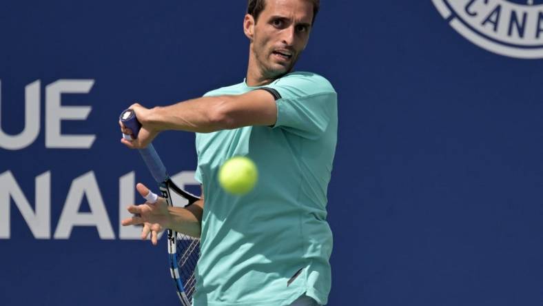 Aug 11, 2022; Montreal, QC, Canada; Albert Ramos-Vinolas (ESP) hits a forehand against against Hubert Hurkacz (POL) (not pictured) in third round play in the National Bank Open at IGA Stadium. Mandatory Credit: Eric Bolte-USA TODAY Sports