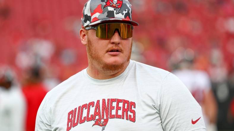 Aug 13, 2022; Tampa, Florida, USA;  Tampa Bay Buccaneers center Ryan Jensen (66) looks on from the field during warm ups before a game against the Miami Dolphins during preseason at Raymond James Stadium. Mandatory Credit: Nathan Ray Seebeck-USA TODAY Sports