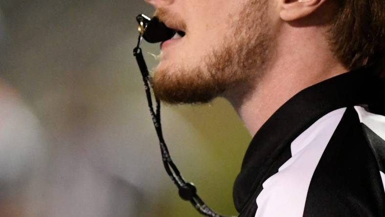 A referee blows the whistle during the Monterey-Abilene Wylie football game Thursday, Sept. 1, 2022, at PlainsCapital Park at Lowrey Field.