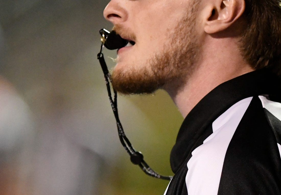 A referee blows the whistle during the Monterey-Abilene Wylie football game Thursday, Sept. 1, 2022, at PlainsCapital Park at Lowrey Field.