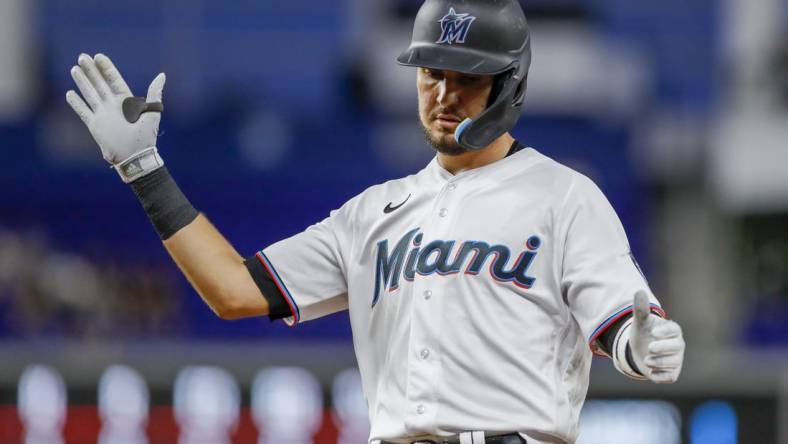 Sep 21, 2022; Miami, Florida, USA; Miami Marlins third baseman Jordan Groshans (65) reacts from first base after hitting a single during the third inning against the Chicago Cubs at loanDepot Park. Mandatory Credit: Sam Navarro-USA TODAY Sports