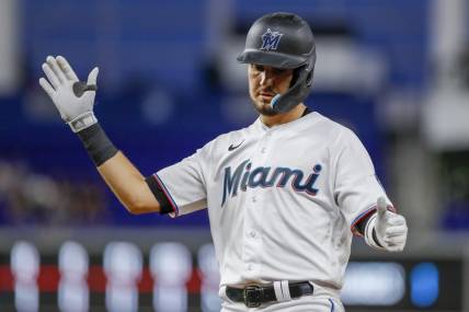 Sep 21, 2022; Miami, Florida, USA; Miami Marlins third baseman Jordan Groshans (65) reacts from first base after hitting a single during the third inning against the Chicago Cubs at loanDepot Park. Mandatory Credit: Sam Navarro-USA TODAY Sports