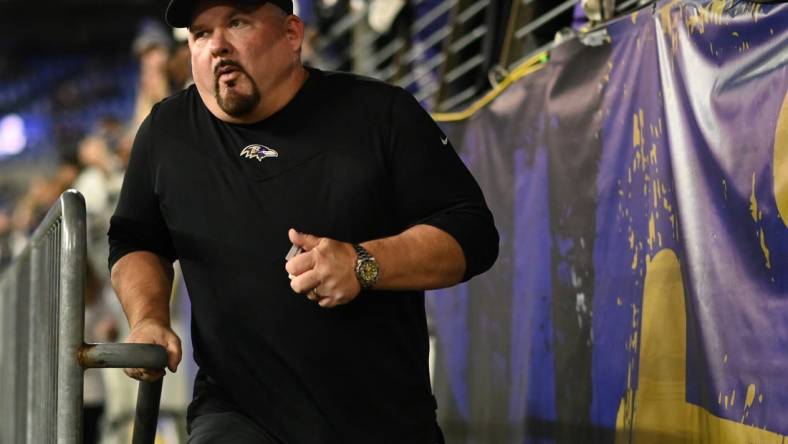 Oct 9, 2022; Baltimore, Maryland, USA;  Baltimore Ravens offensive coordinator Greg Roman runs on the field  before the game against the Cincinnati Bengals at M&T Bank Stadium. Mandatory Credit: Tommy Gilligan-USA TODAY Sports