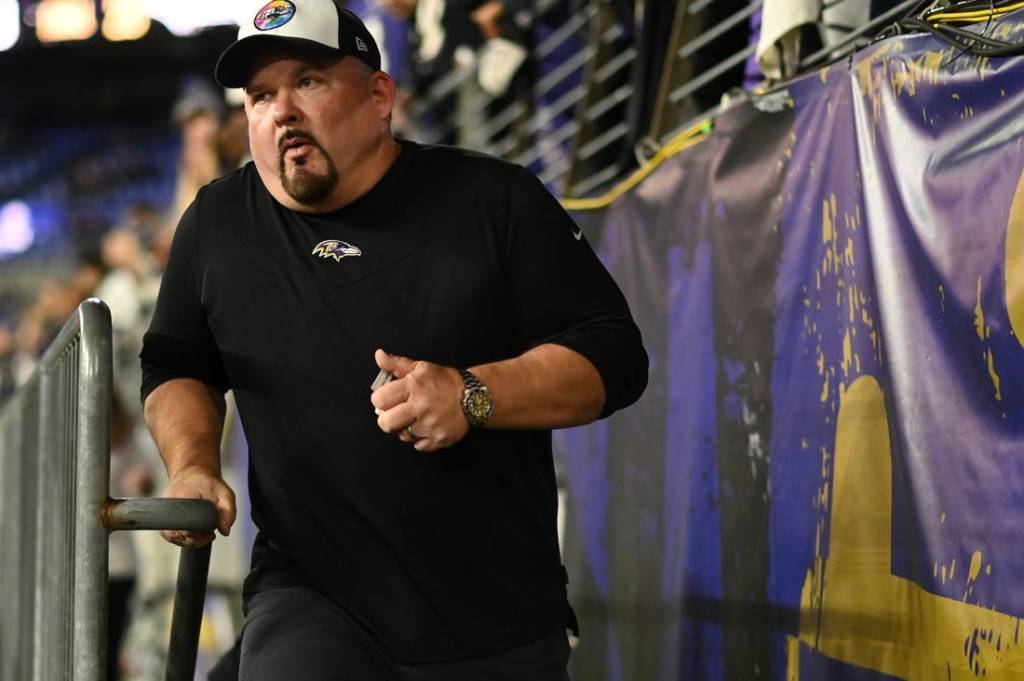 Oct 9, 2022; Baltimore, Maryland, USA;  Baltimore Ravens offensive coordinator Greg Roman runs on the field  before the game against the Cincinnati Bengals at M&T Bank Stadium. Mandatory Credit: Tommy Gilligan-USA TODAY Sports