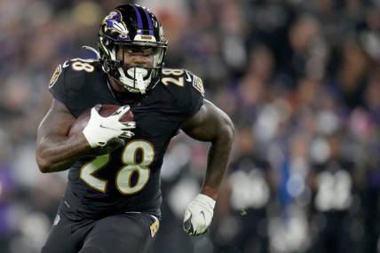 Baltimore Ravens running back Mike Davis (28) carries the ball in the second quarter during an NFL Week 5 game against the Cincinnati Bengals, Sunday, Oct. 9, 2022, at M&T Bank Stadium in Baltimore.

Nfl Cincinnati Bengals At Baltimore Ravens Oct 9 0176