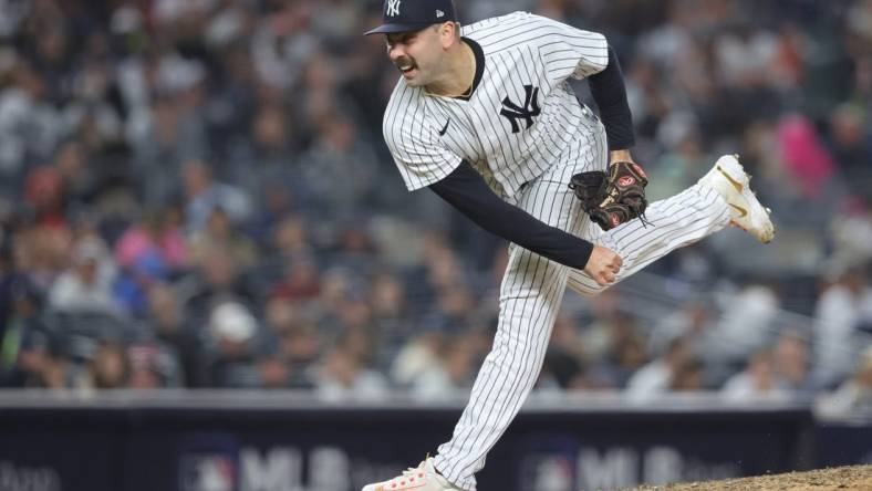 Oct 22, 2022; Bronx, New York, USA;  New York Yankees relief pitcher Lou Trivino (56) pitches in the seventh inning against the Houston Astros during game three of the ALCS for the 2022 MLB Playoffs at Yankee Stadium. Mandatory Credit: Brad Penner-USA TODAY Sports