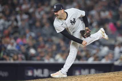 Oct 22, 2022; Bronx, New York, USA;  New York Yankees relief pitcher Lou Trivino (56) pitches in the seventh inning against the Houston Astros during game three of the ALCS for the 2022 MLB Playoffs at Yankee Stadium. Mandatory Credit: Brad Penner-USA TODAY Sports