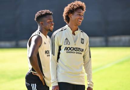 Nov 2, 2022; Los Angeles, California, US;  LAFC forward Kwadwo Opokug (22) and defender Julian Gaines (80) laugh during practice at the Nectar Performance Center.  Mandatory Credit: Jayne Kamin-Oncea-USA TODAY Sports
