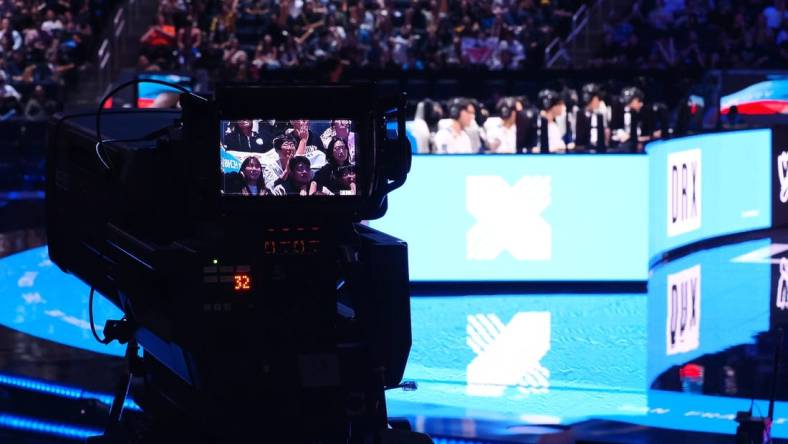 Nov 5, 2022; San Francisco, California, USA; A camera follow fans with DRX in the background during the League of Legends World Championships against T1 at Chase Center. Mandatory Credit: Kelley L Cox-USA TODAY Sports