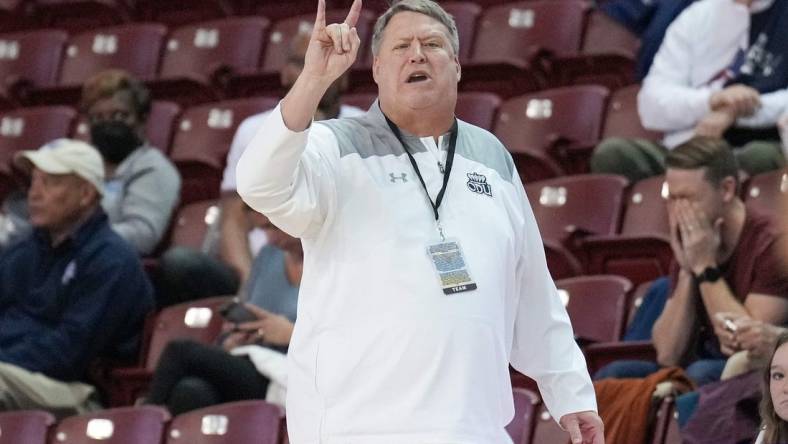 Nov 20, 2022; Charleston, South Carolina, USA; Old Dominion Monarchs head coach Jeff Jones signals his team in the first half against the Davidson Wildcats at TD Arena. Mandatory Credit: David Yeazell-USA TODAY Sports